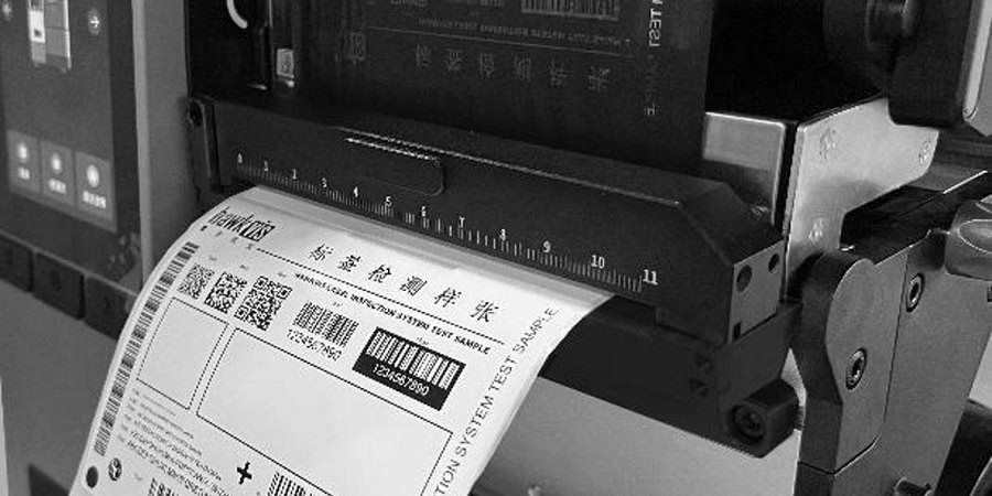 On-printer label inspection system verifying barcode quality on a printed test label